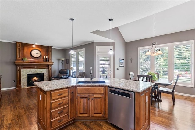 16369 S Woodstone Dr, Olathe, KS 66062 - kitchen with stainless steel dishwasher, a high end fireplace, dark wood-style flooring, brown cabinetry, and ornamental molding