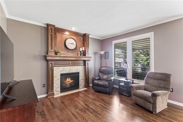 16369 S Woodstone Dr, Olathe, KS 66062 - living room featuring dark wood finished floors, a high end fireplace, ornamental molding, and a textured ceiling