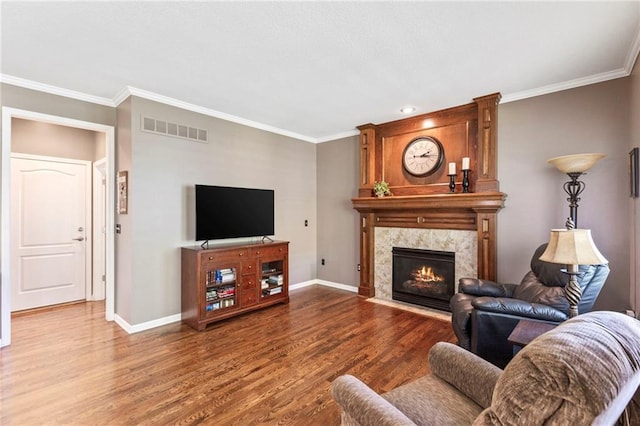 16369 S Woodstone Dr, Olathe, KS 66062 - living room featuring wood finished floors, ornamental molding, and a fireplace
