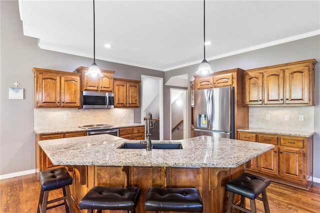16369 S Woodstone Dr, Olathe, KS 66062 - kitchen with appliances with stainless steel finishes, brown cabinetry, dark wood-style flooring, tasteful backsplash, and ornamental molding