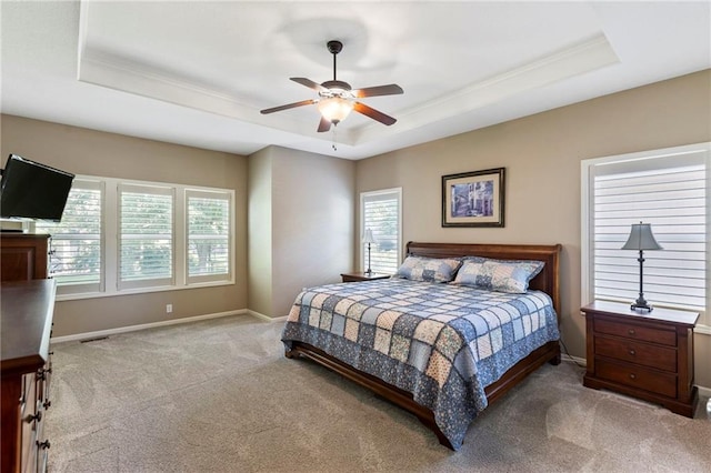 16369 S Woodstone Dr, Olathe, KS 66062 - bedroom featuring a tray ceiling, carpet, ornamental molding, and a ceiling fan
