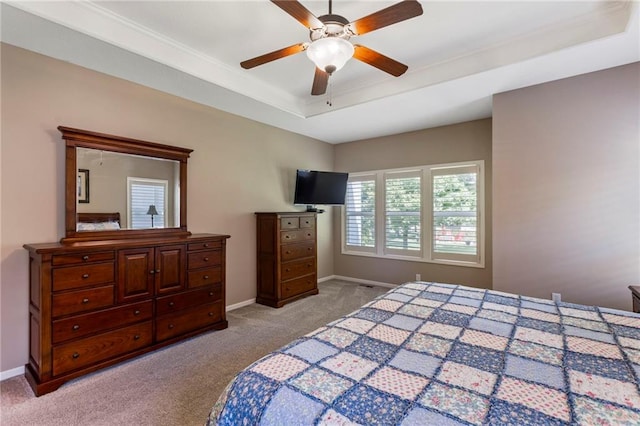 16369 S Woodstone Dr, Olathe, KS 66062 - carpeted bedroom featuring a tray ceiling and a ceiling fan
