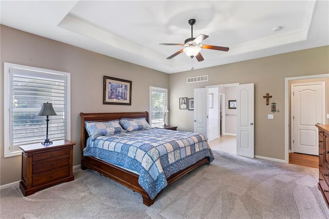 16369 S Woodstone Dr, Olathe, KS 66062 - bedroom with a raised ceiling, light colored carpet, ceiling fan, and crown molding