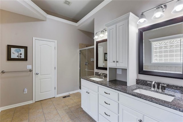 16369 S Woodstone Dr, Olathe, KS 66062 - full bath with a stall shower, crown molding, double vanity, and tile patterned flooring