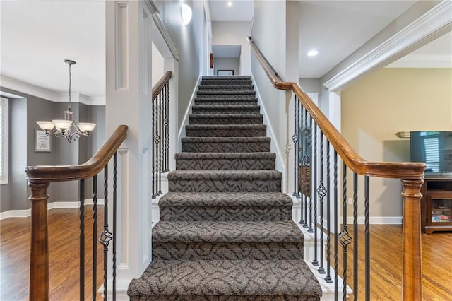 16369 S Woodstone Dr, Olathe, KS 66062 - staircase with wood finished floors, a chandelier, crown molding, and recessed lighting