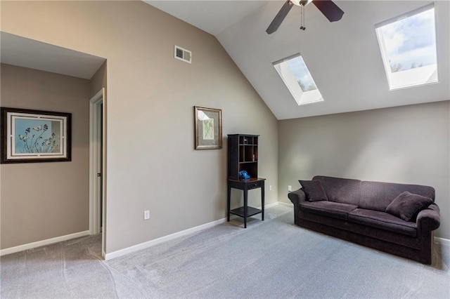16369 S Woodstone Dr, Olathe, KS 66062 - living area featuring carpet, a skylight, vaulted ceiling, and a ceiling fan
