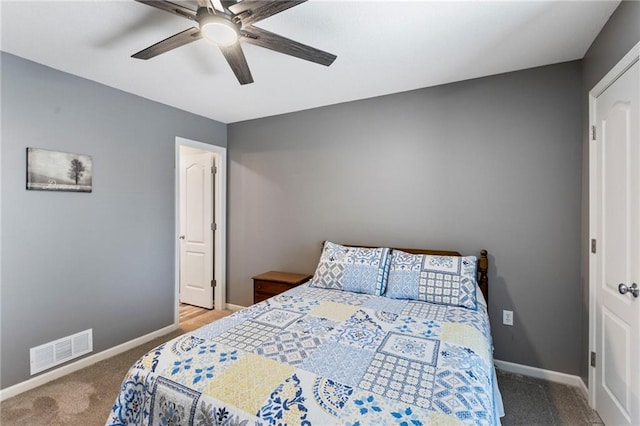 16369 S Woodstone Dr, Olathe, KS 66062 - carpeted bedroom with baseboards and a ceiling fan