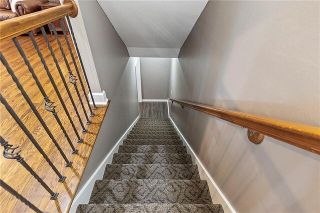 16369 S Woodstone Dr, Olathe, KS 66062 - stairway with baseboards and carpet flooring