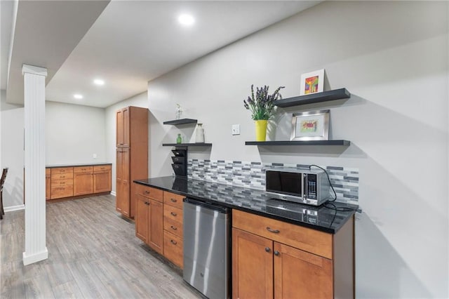 16369 S Woodstone Dr, Olathe, KS 66062 - kitchen with open shelves, fridge, stainless steel microwave, backsplash, and light wood-style flooring