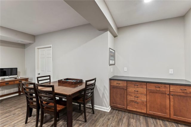 16369 S Woodstone Dr, Olathe, KS 66062 - dining room with dark wood-type flooring and baseboards