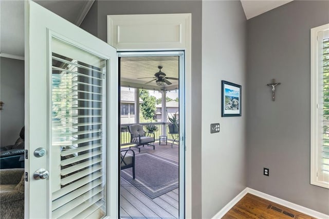 16369 S Woodstone Dr, Olathe, KS 66062 - doorway with a ceiling fan, dark wood finished floors, and ornamental molding