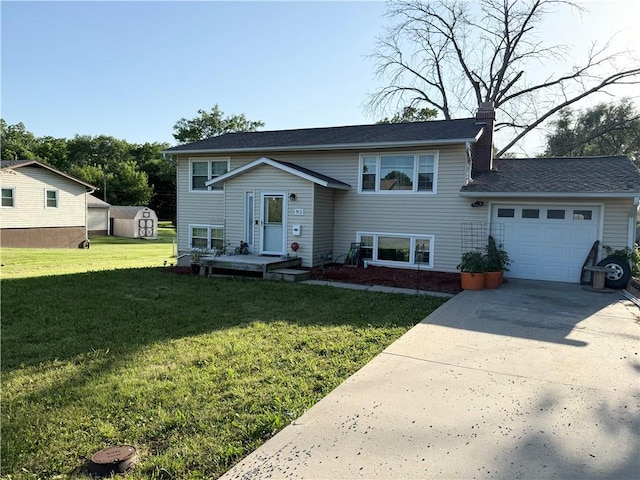 913 N Pine St, Cameron, MO 64429 - raised ranch with a garage, a chimney, concrete driveway, and a front lawn
