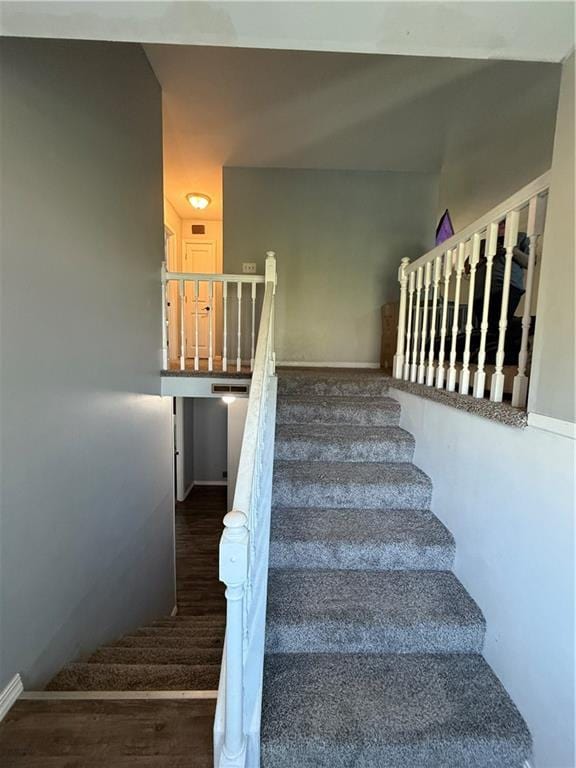 913 N Pine St, Cameron, MO 64429 - stairs featuring wood finished floors