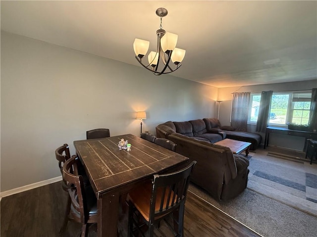 913 N Pine St, Cameron, MO 64429 - dining area with a chandelier and wood finished floors