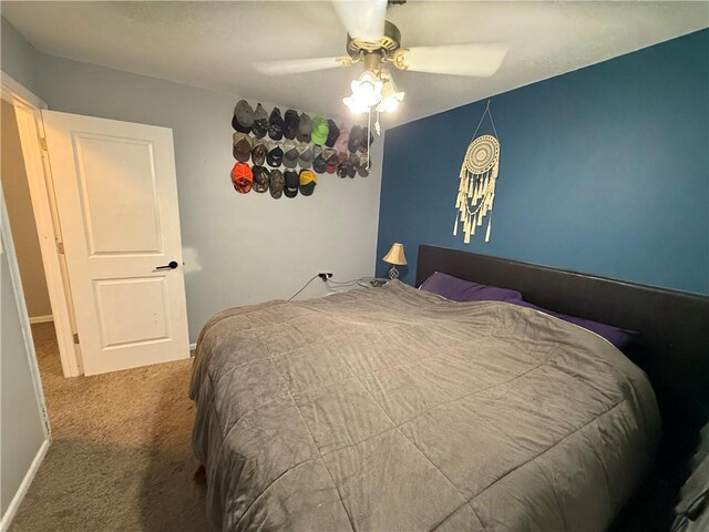 913 N Pine St, Cameron, MO 64429 - bedroom with carpet and a ceiling fan