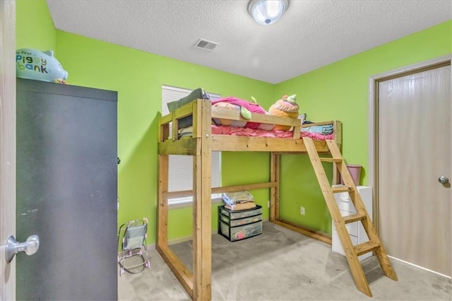 4540 NE 83rd Ter, Kansas City, MO 64119 - carpeted bedroom featuring a textured ceiling and baseboards
