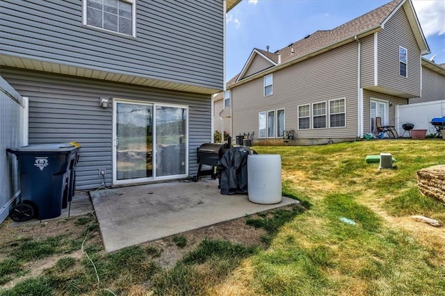 4540 NE 83rd Ter, Kansas City, MO 64119 - back of house featuring a patio area and a yard
