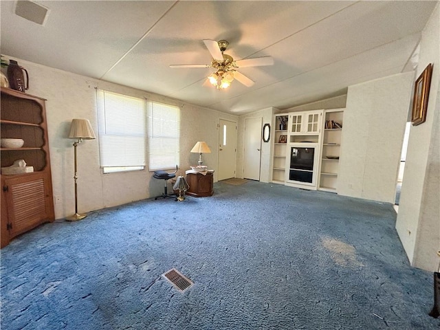 122 Fairway Dr, Mound City, KS 66056 - unfurnished living room with carpet, lofted ceiling, and ceiling fan