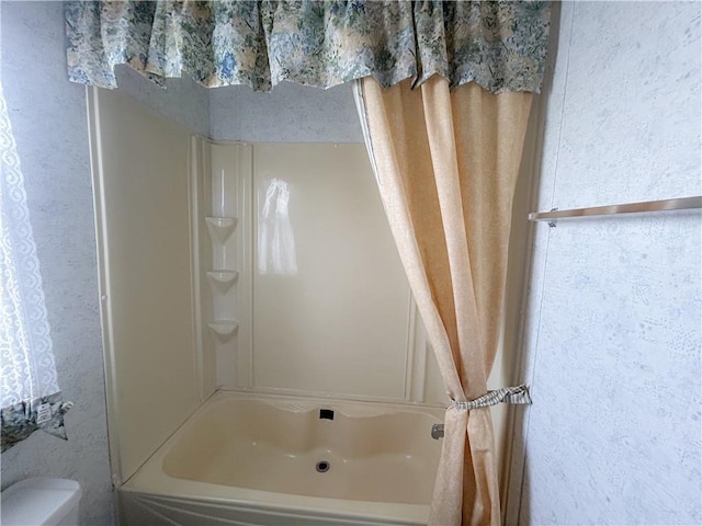 122 Fairway Dr, Mound City, KS 66056 - bathroom featuring shower / bath combination and toilet