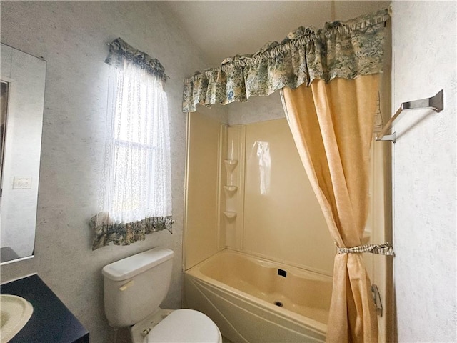 122 Fairway Dr, Mound City, KS 66056 - bathroom featuring vanity, shower / bathtub combination with curtain, and a textured wall