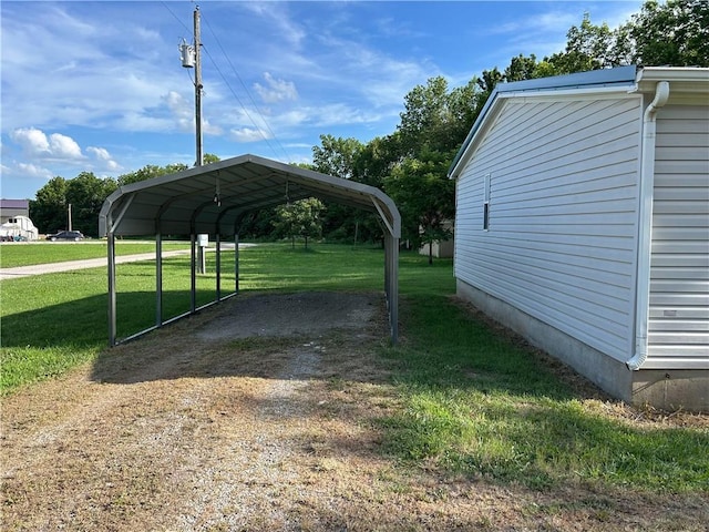 122 Fairway Dr, Mound City, KS 66056 - view of parking / parking lot with a detached carport and dirt driveway