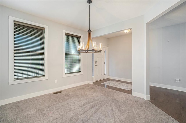 14446 Houston St, Olathe, KS 66061 - entrance foyer with a chandelier and carpet floors