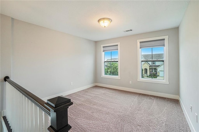 14446 Houston St, Olathe, KS 66061 - carpeted empty room featuring baseboards