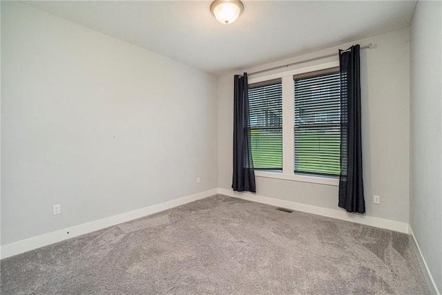 14446 Houston St, Olathe, KS 66061 - empty room featuring carpet and baseboards
