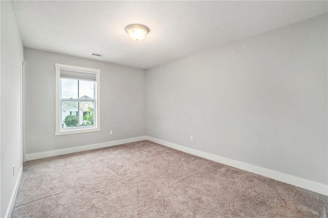 14446 Houston St, Olathe, KS 66061 - carpeted spare room with baseboards and a textured ceiling