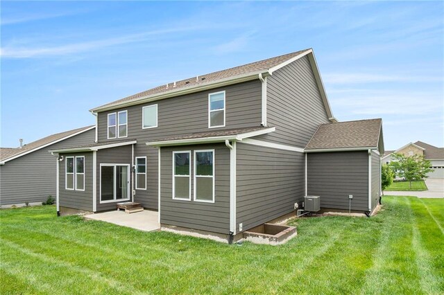 14446 Houston St, Olathe, KS 66061 - rear view of house featuring a yard and a patio