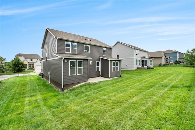 14446 Houston St, Olathe, KS 66061 - back of property featuring a yard, a patio, and a residential view