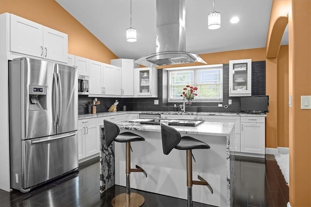 7103 E 159th St, Belton, MO 64012 - kitchen featuring appliances with stainless steel finishes, island exhaust hood, lofted ceiling, a kitchen breakfast bar, and white cabinetry