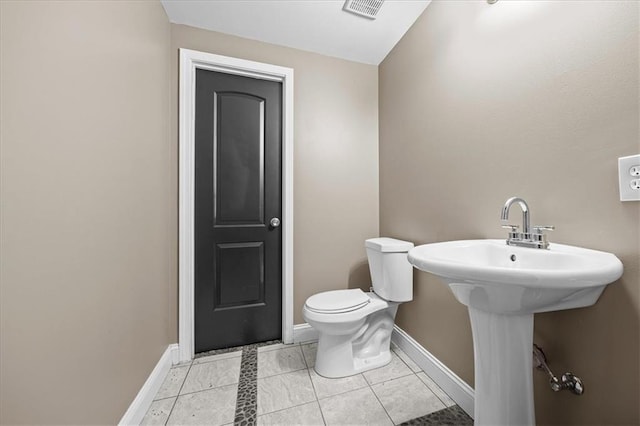 7103 E 159th St, Belton, MO 64012 - bathroom with toilet and baseboards