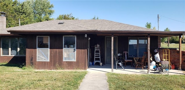 16204 W 162nd St, Lawson, MO 64062 - rear view of house with roof with shingles, a patio area, a lawn, and a chimney