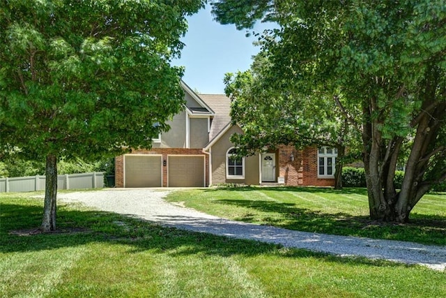 3147 N 131st St, Kansas City, KS 66109 - obstructed view of property with driveway, stucco siding, and an attached garage