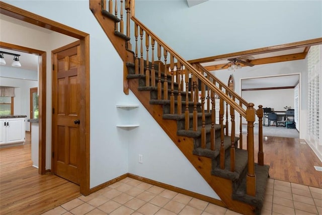 3147 N 131st St, Kansas City, KS 66109 - staircase with ceiling fan and tile patterned floors