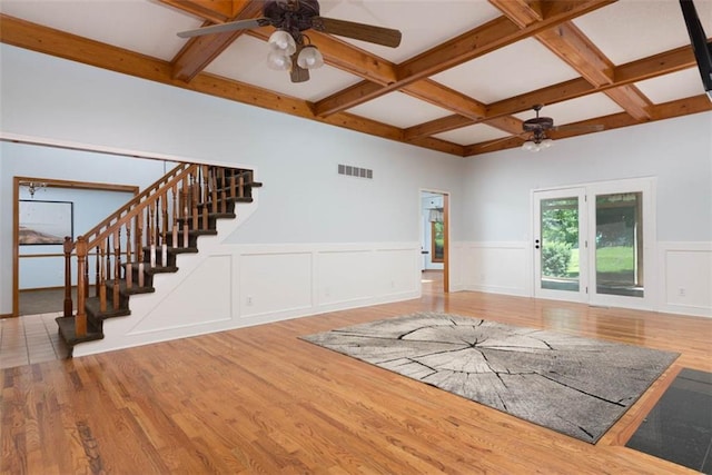 3147 N 131st St, Kansas City, KS 66109 - unfurnished living room with a ceiling fan, coffered ceiling, stairs, beam ceiling, and wood finished floors