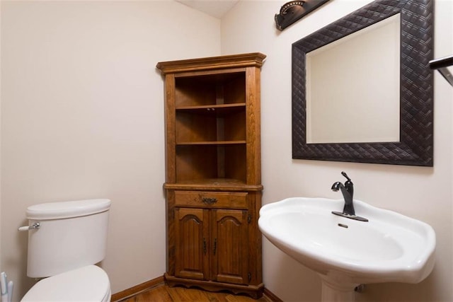 3147 N 131st St, Kansas City, KS 66109 - half bathroom featuring a sink and wood finished floors