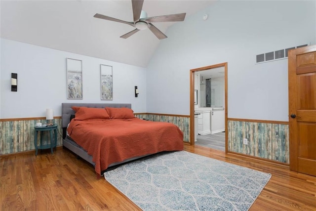 3147 N 131st St, Kansas City, KS 66109 - bedroom with light wood-style floors, ensuite bathroom, ceiling fan, and high vaulted ceiling