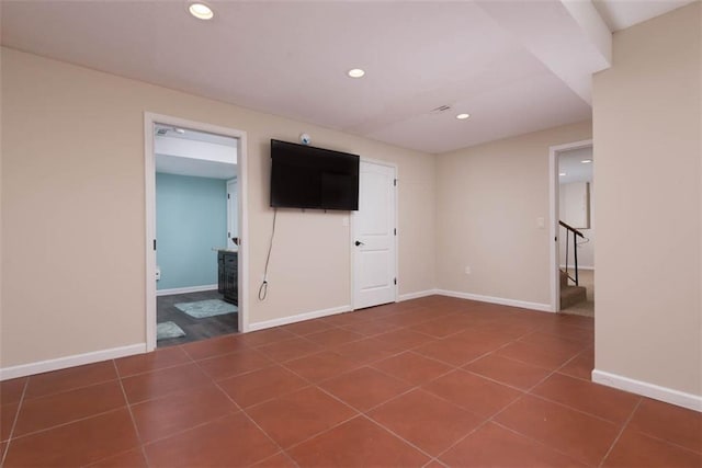 3147 N 131st St, Kansas City, KS 66109 - spare room with stairway, recessed lighting, and dark tile patterned floors