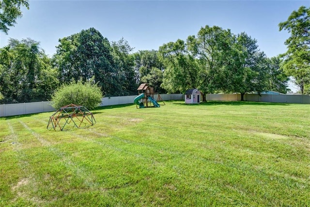 3147 N 131st St, Kansas City, KS 66109 - fenced backyard with a playground and a storage shed