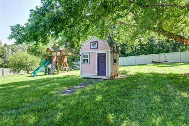 3147 N 131st St, Kansas City, KS 66109 - view of shed with a fenced backyard and a playground
