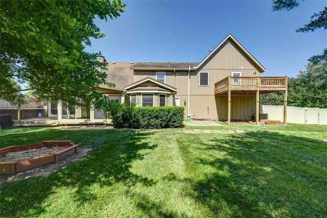 3147 N 131st St, Kansas City, KS 66109 - back of property featuring a fenced backyard and a wooden deck