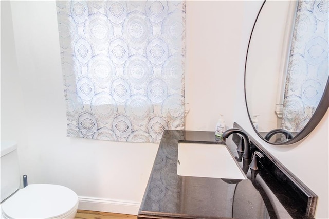 1811 Kimball Ave, Kansas City, KS 66104 - bathroom featuring toilet and wood finished floors
