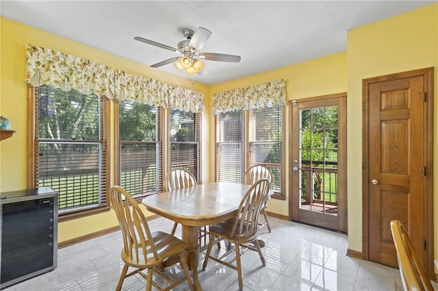 11808 W 128th St, Overland Park, KS 66213 - dining space featuring ceiling fan and light tile patterned flooring