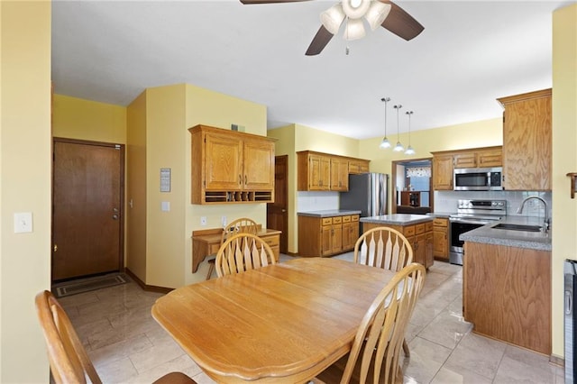 11808 W 128th St, Overland Park, KS 66213 - dining area with ceiling fan and light tile patterned floors