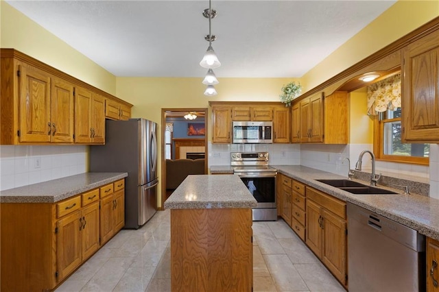 11808 W 128th St, Overland Park, KS 66213 - kitchen featuring stainless steel appliances, decorative backsplash, a center island, and brown cabinetry