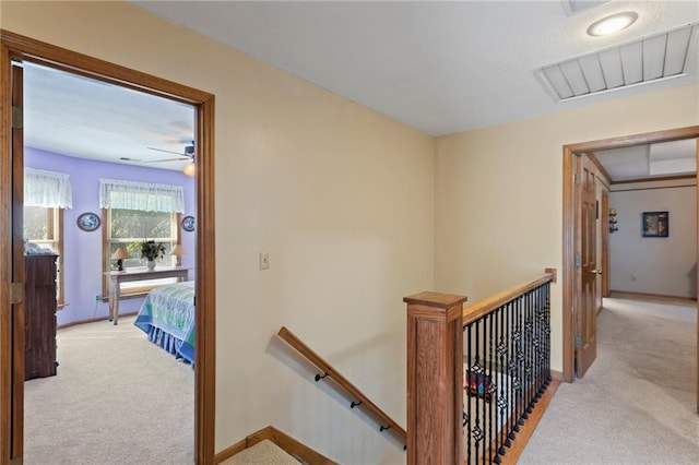 11808 W 128th St, Overland Park, KS 66213 - hallway with an upstairs landing and light carpet
