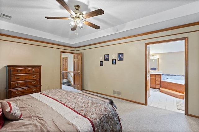 11808 W 128th St, Overland Park, KS 66213 - bedroom featuring carpet, a raised ceiling, ornamental molding, connected bathroom, and a ceiling fan