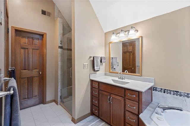11808 W 128th St, Overland Park, KS 66213 - bathroom with a shower stall, vanity, vaulted ceiling, tile patterned flooring, and a bath